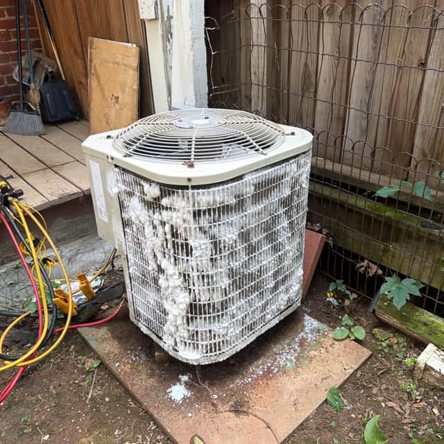 Heavily fouled residential condenser coil with gauges connected