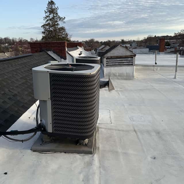 Rooftop condensers on a commercial flat roof