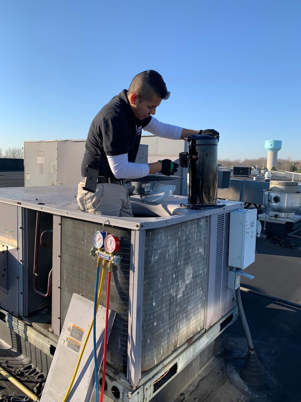 Gask Technical Services technician working on a rooftop package unit